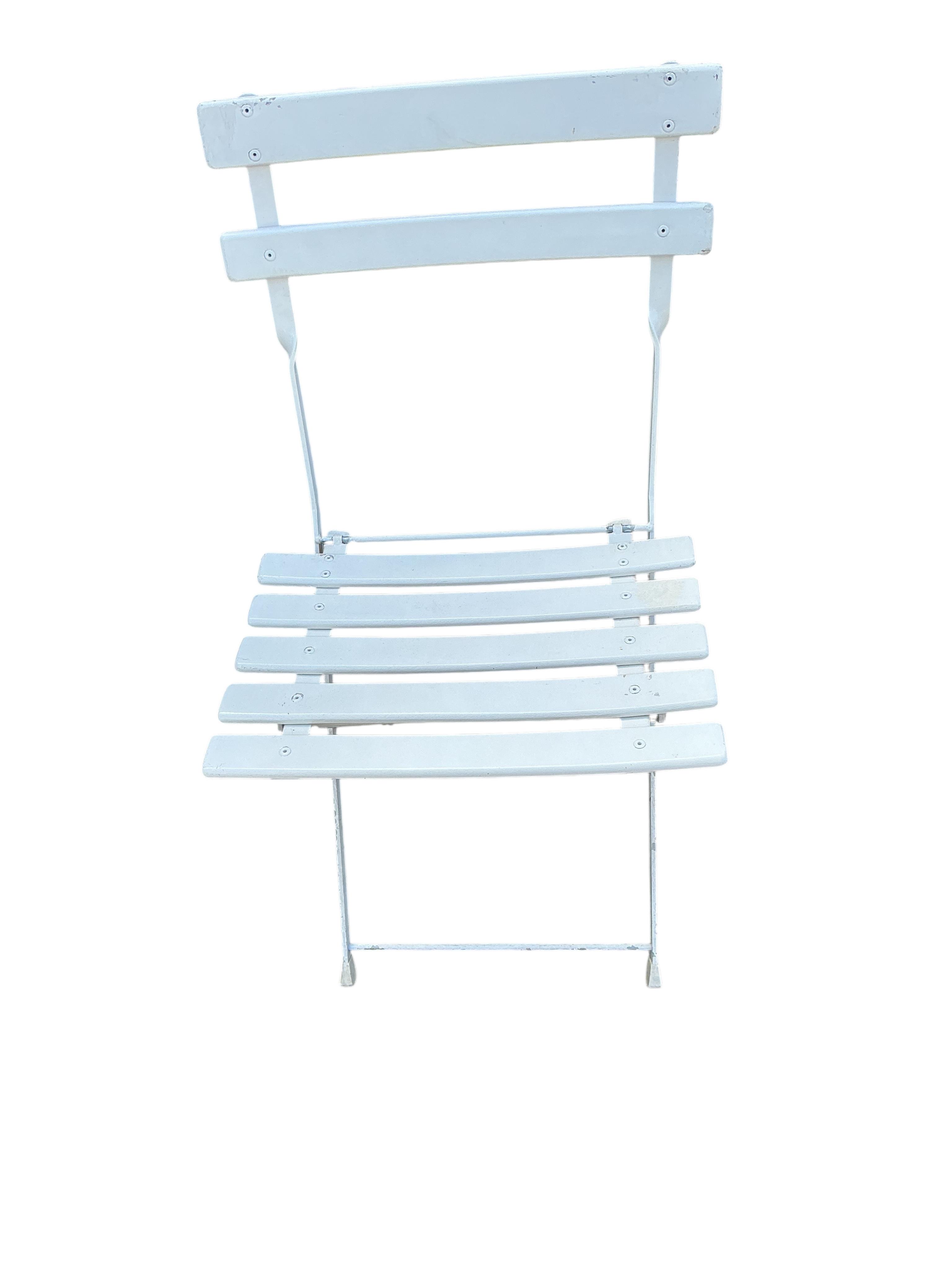 A set of four Emu (Italian) painted metal folding garden chairs